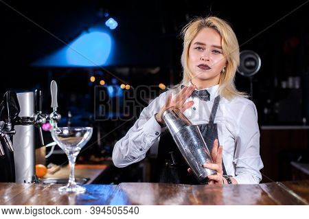 Expert Girl Barman Demonstrates The Process Of Making A Cocktail In The Pub
