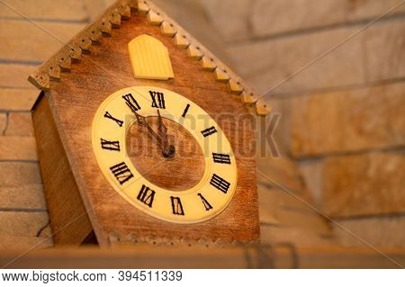 Old Clock On A Wooden Light Wall. Vintage Clock. Cuckoo Clock. Copy-space.