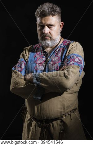 Mature Bearded Man In Traditional Historic Clothes