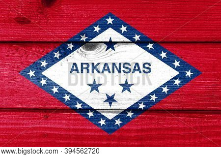 Arkansas Flag Painted On Old Wood Plank Background. Brushed Natural Light Knotted Wooden Board Textu