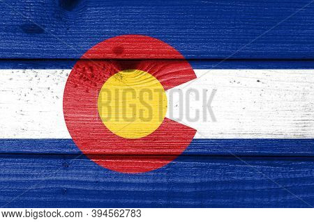 Colorado Flag Painted On Old Wood Plank Background. Brushed Natural Light Knotted Wooden Board Textu