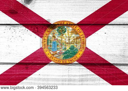 Florida Flag Painted On Old Wood Plank Background. Brushed Natural Light Knotted Wooden Board Textur