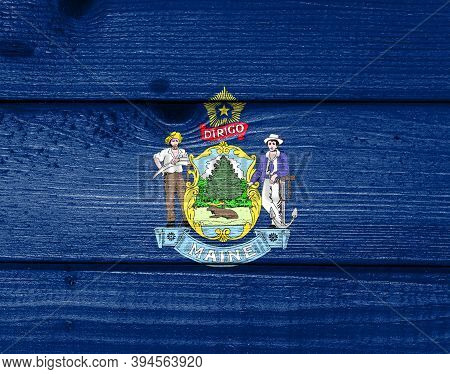 Maine Flag Painted On Old Wood Plank Background. Brushed Natural Light Knotted Wooden Board Texture.