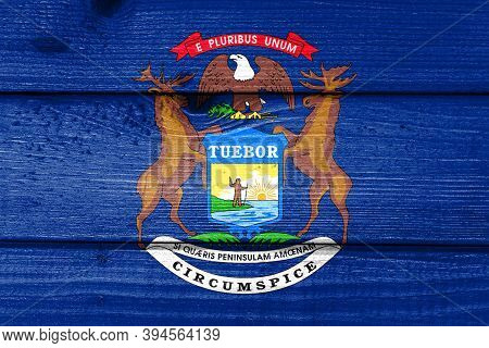 Michigan Flag Painted On Old Wood Plank Background. Brushed Natural Light Knotted Wooden Board Textu