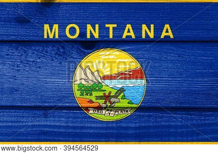 Montana Flag Painted On Old Wood Plank Background. Brushed Natural Light Knotted Wooden Board Textur