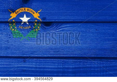 Nevada Flag Painted On Old Wood Plank Background. Brushed Natural Light Knotted Wooden Board Texture