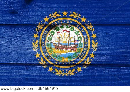 New Hampshire Flag Painted On Old Wood Plank Background. Brushed Natural Light Knotted Wooden Board 