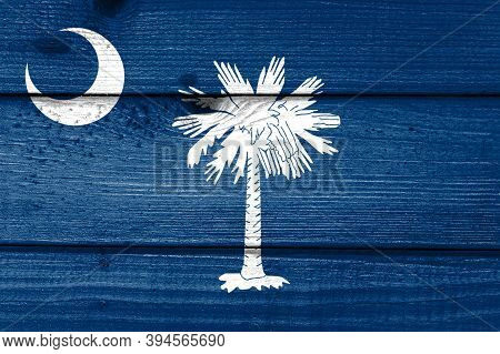 South Carolina Flag Painted On Old Wood Plank Background. Brushed Natural Light Knotted Wooden Board