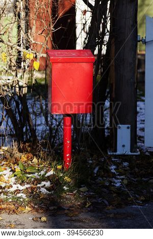 A Red Metal Mailbox In Sunset At Roback
