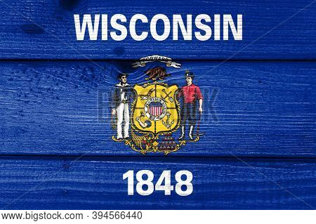 Wisconsin Flag Painted On Old Wood Plank Background. Brushed Natural Light Knotted Wooden Board Text