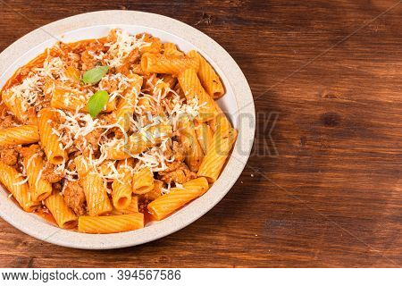 Cooking Tortiglioni With Onion And Sausage Ragout, Pasta With Sausage Sauce With Onions And Tomato P