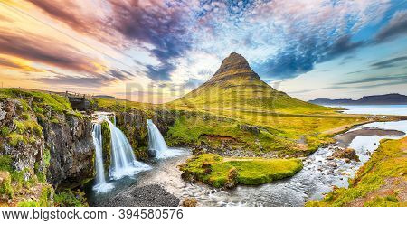 Dramatic View On Kirkjufellsfoss Waterfall  Near Kirkjufell Mountain At Sunset.  Location: Kirkjufel