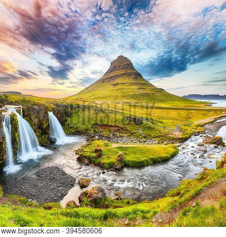 Dramatic View On Kirkjufellsfoss Waterfall  Near Kirkjufell Mountain At Sunset.  Location: Kirkjufel