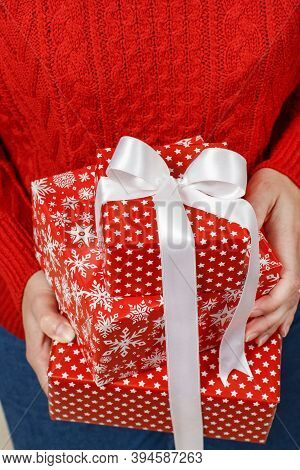Woman In Red Sweater Haolding Presents In Hands Close Up