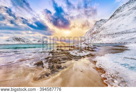 Fantastic Winter View Of Haukland Beach During Sunset With Lots Of Snow  And Snowy  Mountain Peaks N
