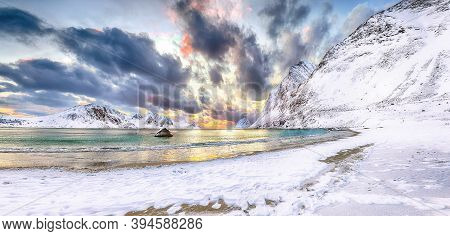 Splendid Winter Scenery With Haukland Beach During Sunset And Snowy  Mountain Peaks Near Leknes.  Lo