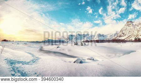 Winter Scenery With Frozen Fjord On Vestvagoy Island At Sunset With Snowy  Mountain Peaks Near Valbe
