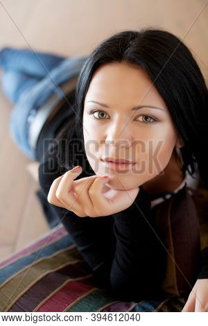 young woman lying on the floo