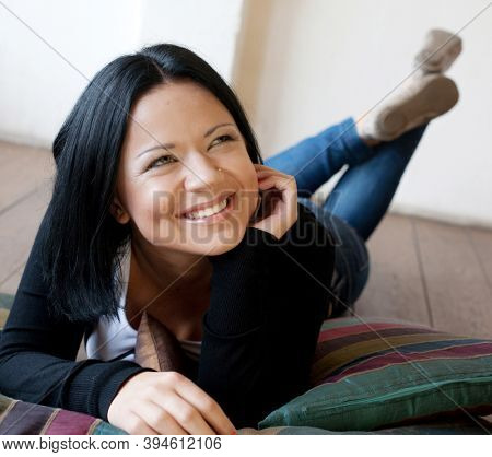 young woman lying on the floo