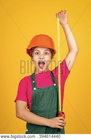 Cute Kid As A Construction Worker. Kid Repairing Home. Happy Childhood. Self-retracting Metal Tape M