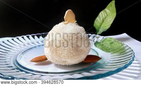 Tasty Rice Laddus In White Plate Garnished With Dry Fruits In India
