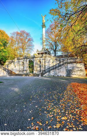 Charming Autumn View Of Angel Of Peace (friedensengel) Monument. Statue Of A Golden Angel On A Colum