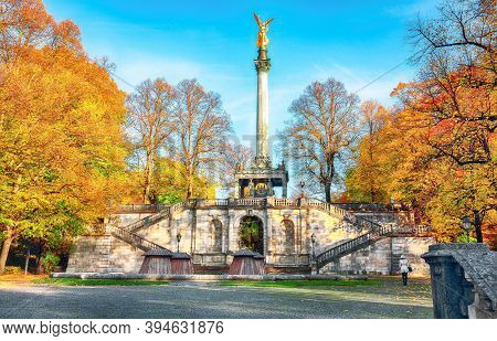 Charming Autumn View Of Angel Of Peace (friedensengel) Monument. Statue Of A Golden Angel On A Colum