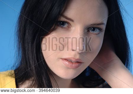 Closeup Of Beautiful Woman And Her Blue Eyes Starring Front Portrait