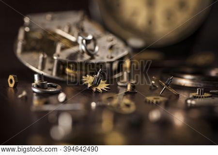 Details Of A Clock On A Wooden Table Close-up