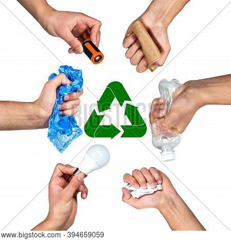 Hands Hold Trash On A Gray Background. The Concept Of Separate Trash, Stop Plastic, Recycling.