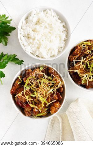Spicy Garlic Fried Chicken (kkanpunggi). Asian Chicken In Sweet And Sour Sauce In Bowl Over White Ba