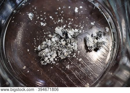 Cigarette Butt In An Ashtray Close-up, Top View