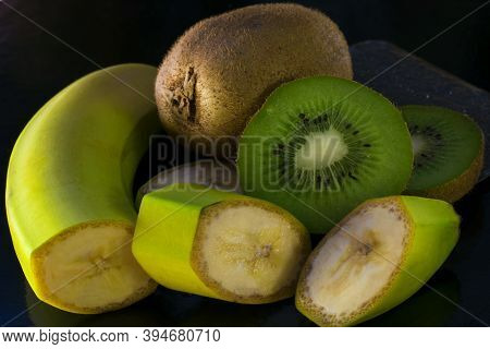 Assortment Of Tropical Fruits On Wooden Table. Still Life With Bananas, Mango, Oranges, Grapefruit A