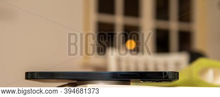Paris, France - Nov 11, 2020: Charging With New Magsafe Wireless Magnetic Charger On The Back Of New