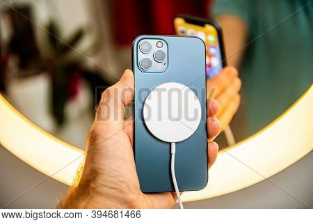 Paris, France - Nov 11, 2020: Man Hand Holding In Front Of Mirror New Iphone 12 Pro Max 5g Smartphon