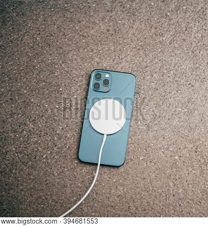 Paris, France - Nov 11, 2020: Charging With The New Magsafe Wireless Charger The Latest Iphone 12 Pr