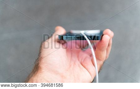 Paris, France - Nov 11, 2020: Hand Holding New Iphone 12 Pro Max 5g Smartphone Model By Apple Comput