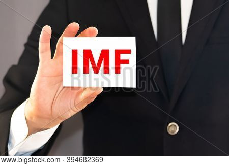 Imf Letters Stand For International Monetary Fund On The Card Shown By A Man.