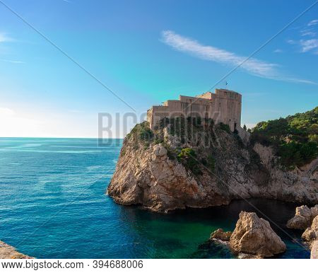 Dubrovnik's Fortica Castle On The Peak Of A Peninsula, Seen While Walking On The Old City Walls Of D
