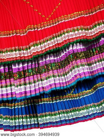 Close Up Of The Lower Edge Of Pleated Skirts, Traditional Women's Clothing For Folk Dancers Of Cayam