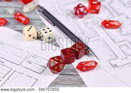 Red Tabletop Role Playing Rpg Game Dices On Blurry Hand Drawn Dungeon Map And Character Sheet