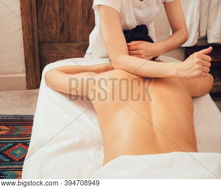 Beautiful Mixed Race Woman Enjoying A Sabai Body Massage. Sabai Massage Is A Combination Of Thai Tra