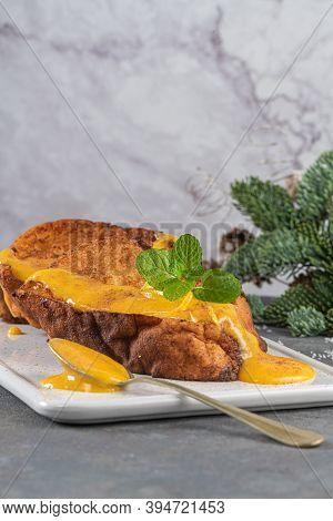 Traditional Christmas Rabanadas With Egg Yolk Cream And Cinnamon. Spanish Torrijas Close Up On The C