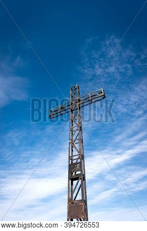 Metal Cross On Blue Sky With Clouds, Peak Of Corno D'aquilio, Lessinia Plateau (altopiano Della Less