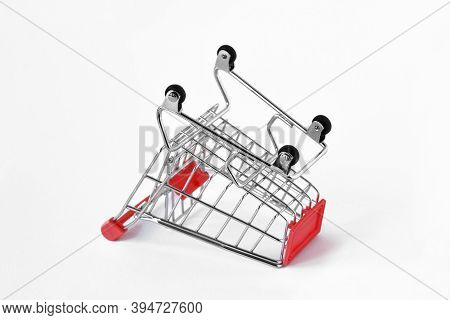Empty Inverted Shopping Cart On White Background - Concept Of Shopping Cart Abandonment