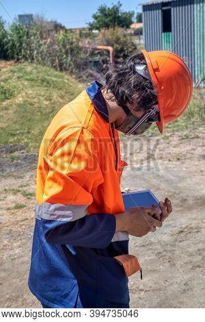 mining engineer holding a tablet at a diamond mine in Botswana 