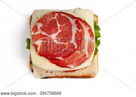 A Slice Of Bread, A Piece Of Cheese, A Lettuce Leaf, Two Pieces Of Raw Smoked Meat, Two Slices Of Cu