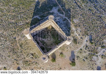 Medieval Castle Called El Montgri At The Top  Mountain Near The Sea In Costa Brava, Catalonia Spain