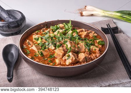 Traditional Chinese Dish Mapo Tofu With Minced Meat And Tofu Cheese In A Bowl On A Linen Rustic Napk