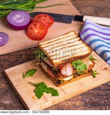 Large Delicious Homemade Square Sandwich With Chicken Breast, Bacon, Salad And Vegetables